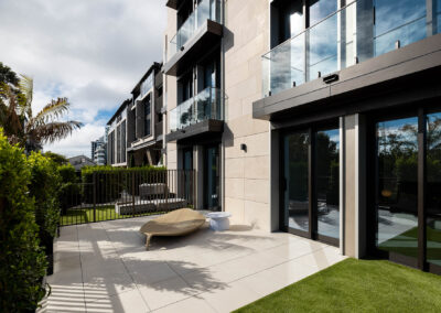 AliClad Max in ironsand matt, FR doors and windows, curtain wall, flashings, louvres and fins.